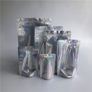 Bolsas de pie holográficas frontales transparentes y sellables al por mayor Bolsas de plástico con cremallera de plástico laminado Embalaje en stock